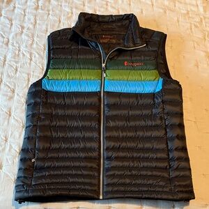 Cotopaxi Black Vest with Green and Blue Accents